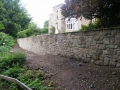 Rebuilt retaining wall following collapse